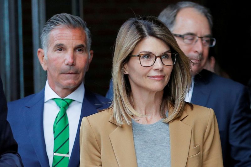 &copy; Reuters. FILE PHOTO: Actor Lori Loughlin, and her husband, fashion designer Mossimo Giannulli, leave the federal courthouse after facing charges in a nationwide college admissions cheating scheme, in Boston, Massachusetts, U.S., April 3, 2019. REUTERS/Brian Snyder