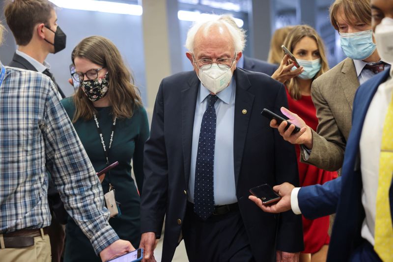 &copy; Reuters. U.S. Senator Bernie Sanders (I-VT) is pursued by reporters in the Senate subway at the U.S. Capitol in Washington, U.S., October 6, 2021. REUTERS/Evelyn Hockstein 