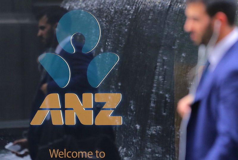 &copy; Reuters. A pedestrian is reflected in the window of a branch of the Australia and New Zealand Banking Group (ANZ) in central Sydney, Australia, October 25, 2017. Picture taken October 25, 2017.     REUTERS/Steven Saphore/Files