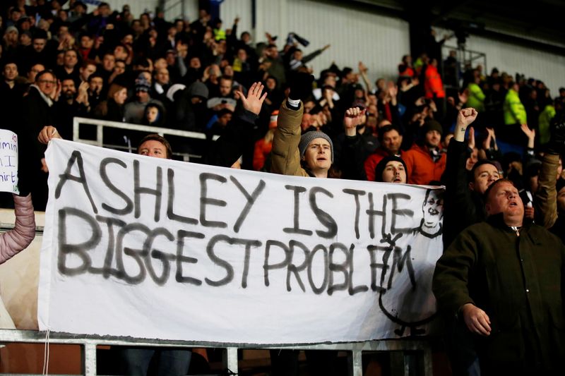 &copy; Reuters. FILE PHOTO: Soccer Football - FA Cup Fourth Round Replay - Oxford United v Newcastle United - Kassam Stadium, Oxford, Britain - February 4, 2020  Newcastle United fans with a banner directed at owner Mike Ashley REUTERS/David Klein/File Photo