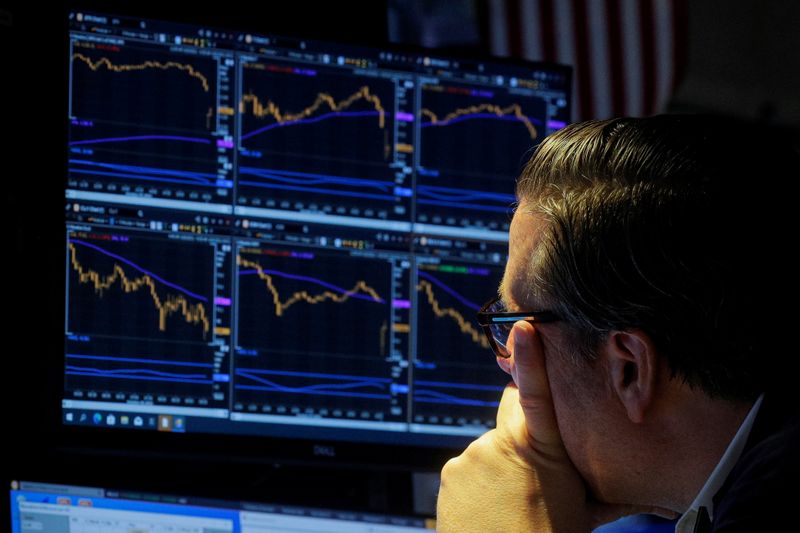 &copy; Reuters. A specialist trader works inside a booth on the floor of the New York Stock Exchange (NYSE) in New York City, U.S., October 6, 2021.  REUTERS/Brendan McDermid