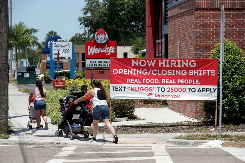 &copy; Reuters. FILE PHOTO: A Wendy’s restaurant displays a "Now Hiring" sign in Tampa, Florida, U.S., June 1, 2021. REUTERS/Octavio Jones/File Photo