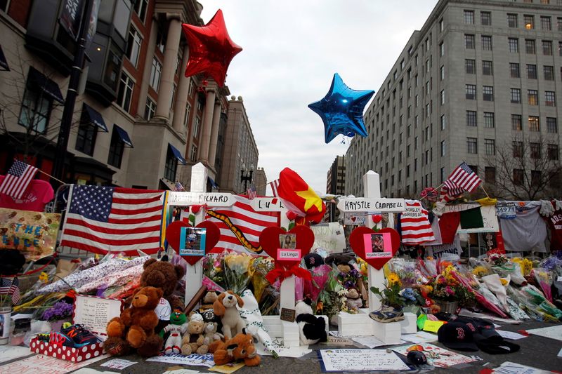© Reuters. FILE PHOTO: Three crosses for each of the three people killed in the Boston Marathon bombings are seen at a makeshift memorial on Boylston Street in Boston, Massachusetts, April 18, 2013. REUTERS/Jessica Rinaldi