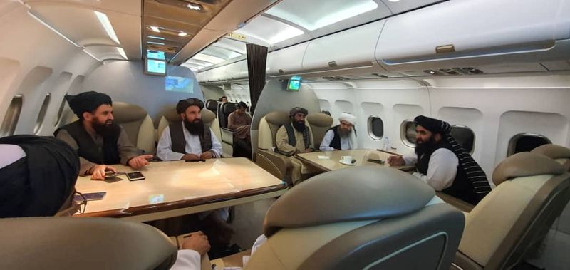 &copy; Reuters. FILE PHOTO: Taliban delegates are seated in a plane in an unidentified location, in this handout photo uploaded to social media on October 9, 2021. Picture uploaded on on October 9, 2021. Social media handout/via REUTERS 