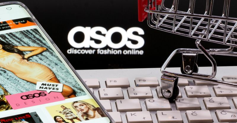 &copy; Reuters. FILE PHOTO: A smartphone with the ASOS app, a keyboard, and a shopping cart are seen in front of a displayed ASOS logo in this illustration picture taken October 13, 2020. REUTERS/Dado Ruvic/Illustration//File Photo