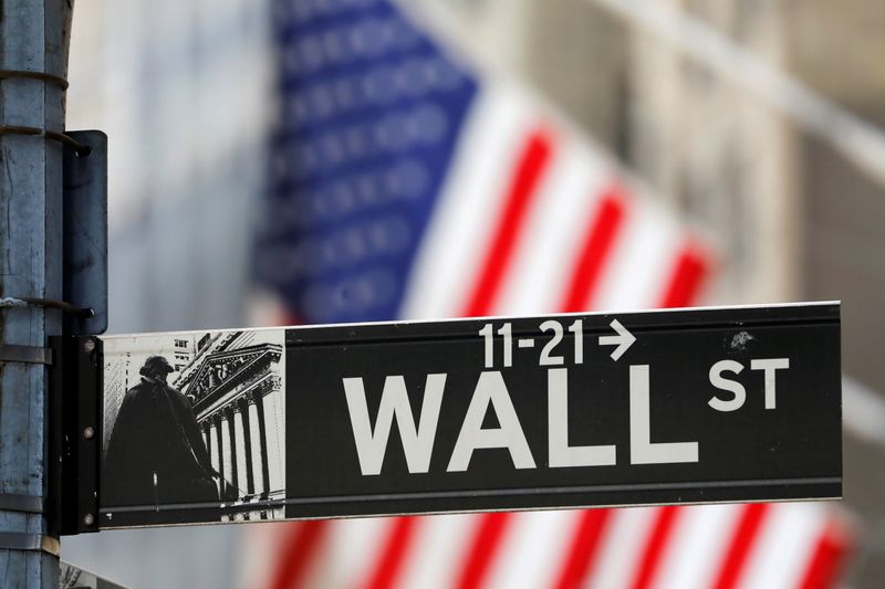 &copy; Reuters. FILE PHOTO: A street sign for Wall Street is seen outside the New York Stock Exchange (NYSE) in New York City, New York, U.S., July 19, 2021. REUTERS/Andrew Kelly 