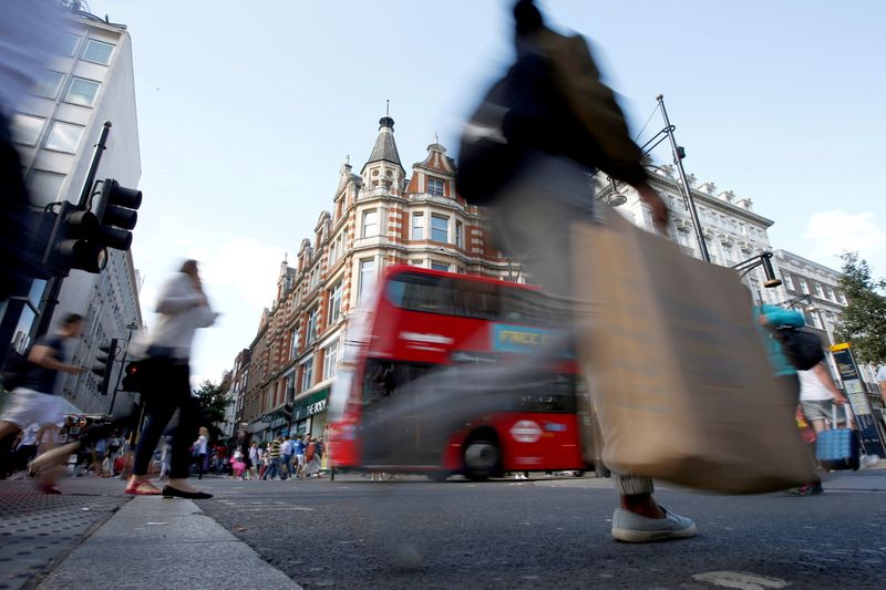 UK shoppers, hit by fuel crisis, turn more cautious on spending