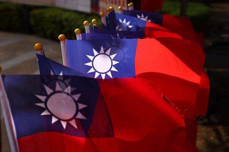 © Reuters. FILE PHOTO: Taiwan flags can be seen at a square ahead of the national day celebration in Taoyuan, Taiwan, October 8, 2021. REUTERS/Ann Wang