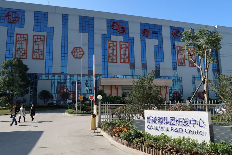 &copy; Reuters. FILE PHOTO: People walk past the R&D centre of Contemporary Amperex Technology Ltd (CATL) in Ningde, Fujian province, China, December 16, 2016.  REUTERS/Jake Spring