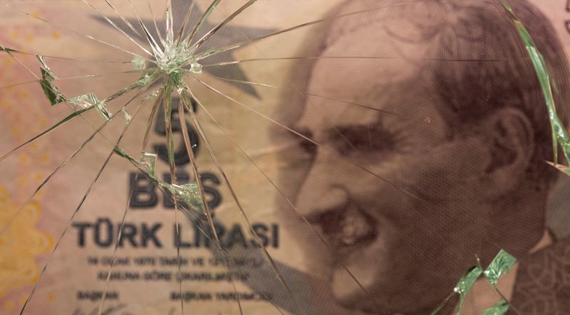 &copy; Reuters. Turkish lira banknote is seen through broken glass in this illustration taken June 25, 2021. REUTERS/Dado Ruvic/Illustration