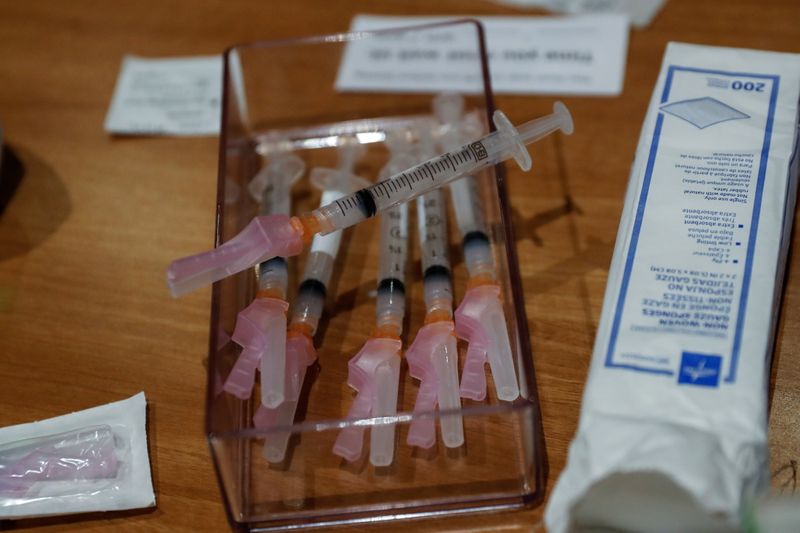 &copy; Reuters. FILE PHOTO: Syringes filled with a dose of the Moderna COVID-19 vaccine sit on a table during an employee vaccination at the Sarasota Memorial Hospital in Sarasota, Florida, U.S., September 24, 2021. REUTERS/Shannon Stapleton