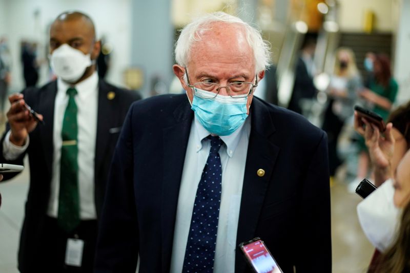 &copy; Reuters. FILE PHOTO: Senator Bernie Sanders (I-VT) speaks to reporters after a vote on as Senators moved toward trying to pass a stop-gap increase in the Treasury Department's $28.4 trillion borrowing authority on Capitol Hill in Washington October 7, 2021.  REUTE