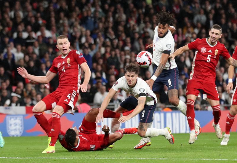 &copy; Reuters. Soccer Football - World Cup - UEFA Qualifiers - Group I - England v Hungary - Wembley Stadium, London, Britain - October 12, 2021 Hungary's Attila Szalai in action with England's John Stones Action Images via Reuters/Carl Recine