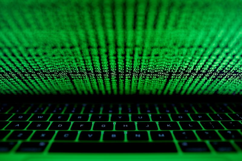 &copy; Reuters. FILE PHOTO: A computer keyboard lit by a displayed cyber code is seen in this illustration picture taken on March 1,  2017. REUTERS/Kacper Pempel/File Photo