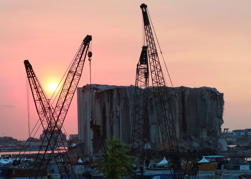 &copy; Reuters. FILE PHOTO: A view shows the grain silo that was damaged during last year's Beirut port blast, during sunset in Beirut, Lebanon, July 29, 2021. REUTERS/Mohamed Azakir