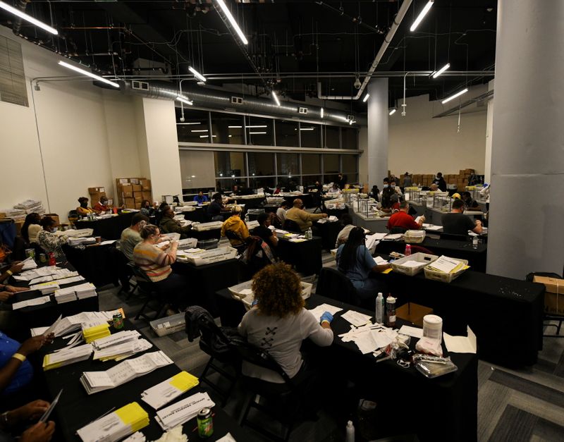 &copy; Reuters. FILE PHOTO: Employees of the Fulton County Board of Registration and Elections process ballots in Atlanta, Georgia U.S., November 4, 2020. REUTERS/Brandon Bell