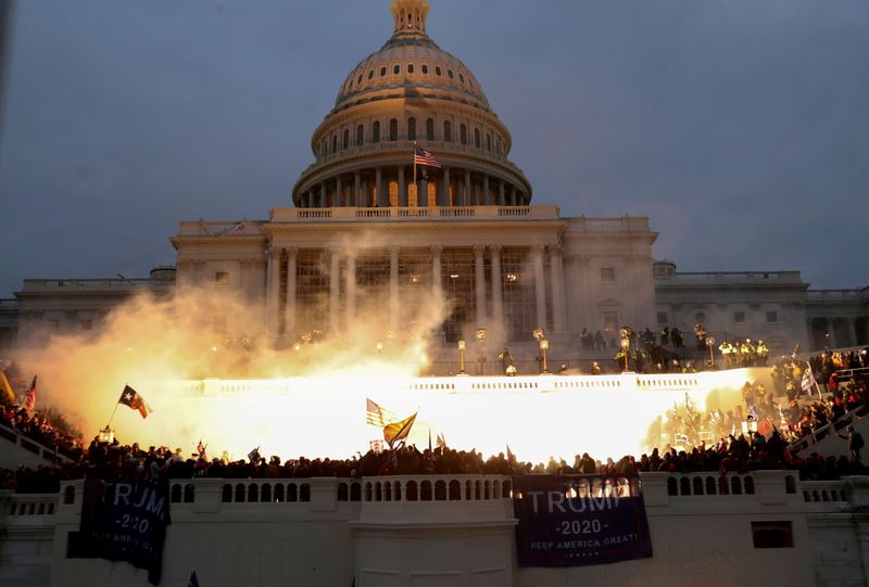 &copy; Reuters. FILE PHOTO: An explosion caused by a police munition is seen while supporters of U.S. President Donald Trump gather in front of the U.S. Capitol Building in Washington, U.S., January 6, 2021. REUTERS/Leah Millis/File Photo/File Photo