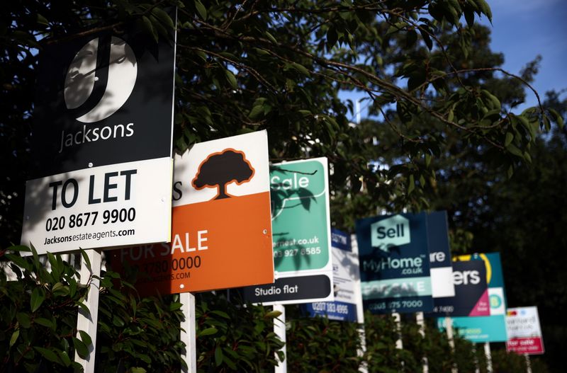 &copy; Reuters. Property estate agent sales and letting signs are seen attached to railings outside an apartment building in south London, Britain, September 23, 2021. REUTERS/Hannah McKay/Files