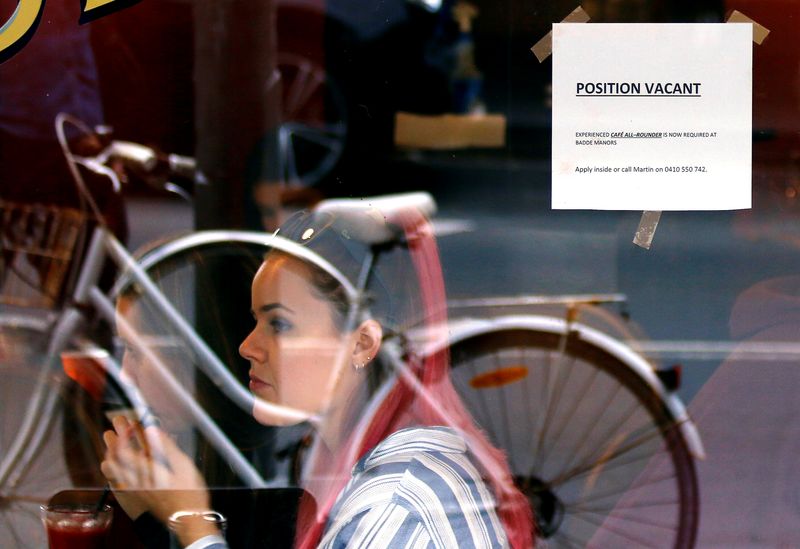 &copy; Reuters. Customers at a local cafe are seen through a window displaying a job vacancy notice in central Sydney, Australia, May 9, 2016. Picture taken May 9, 2016.    REUTERS/Steven Saphore/Files