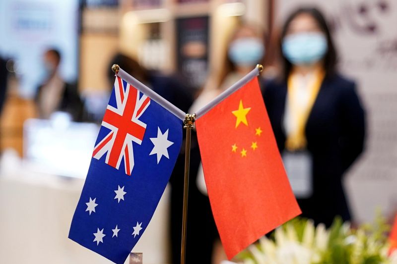 &copy; Reuters. FILE PHOTO: Australian and Chinese flags are seen at the third China International Import Expo (CIIE) in Shanghai, China November 6, 2020. REUTERS/Aly Song/File Photo