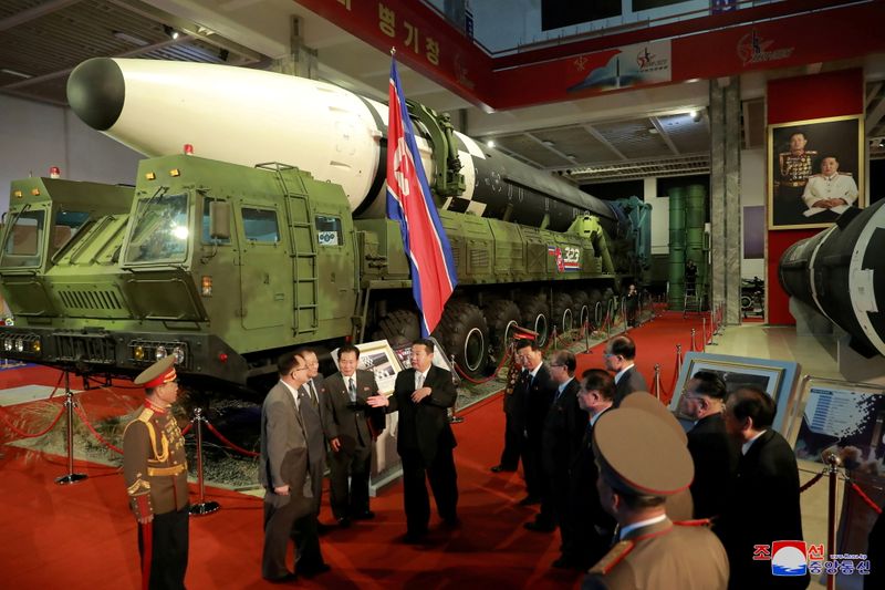 &copy; Reuters. FILE PHOTO: North Korea's leader Kim Jong Un speaks to officials next to military weapons and vehicles on display, including the country's intercontinental ballistic missiles (ICBMs), at the Defence Development Exhibition, in Pyongyang, North Korea, Octob