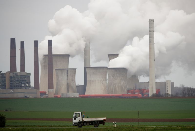 &copy; Reuters. FILE PHOTO: A truck drives by as steam rises from the five brown coal-fired power units of RWE, one of Europe's biggest electricity companies in Neurath, north-west of Cologne, Germany, Germany, March 12, 2019.   REUTERS/Wolfgang Rattay/File Photo