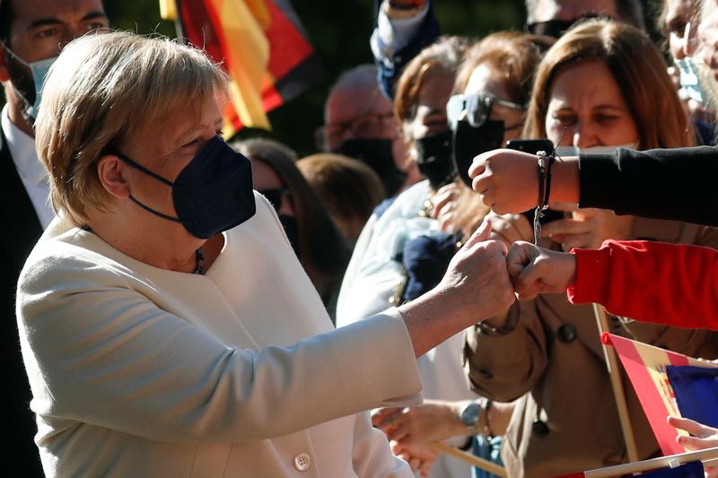 &copy; Reuters. German Chancellor Angela Merkel greets people upon her arrival to receive the "Charles V European Award" at the Monastery of Yuste, in the western Spanish region of Caceres, October 14, 2021. REUTERS/Susana Vera