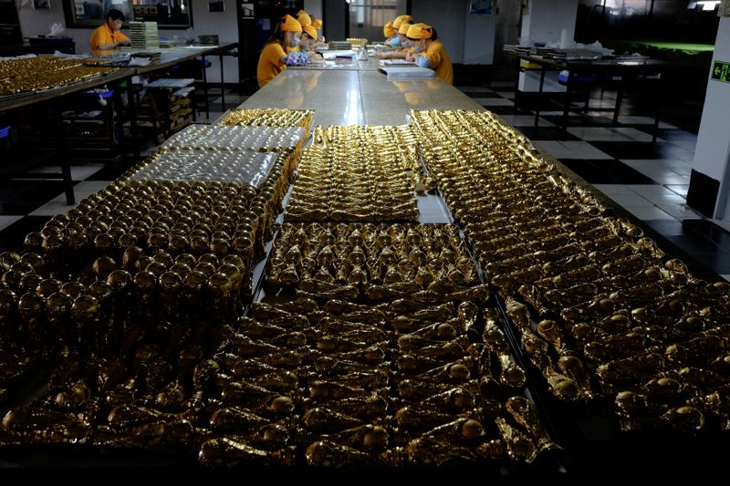 &copy; Reuters. Scaled-down replicas of 2018 FIFA World Cup trophy, made of zinc alloy, are under production at a factory which manufactures official licensed products in Dongguan, China May 8, 2018. Picture taken May 8, 2018.   REUTERS/Bobby Yip