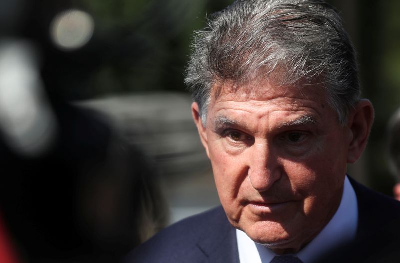 &copy; Reuters. FILE PHOTO: U.S. Senator Joe Manchin (D-WV) faces reporters outside the U.S. Capitol in Washington, U.S., September 30, 2021. REUTERS/Leah Millis