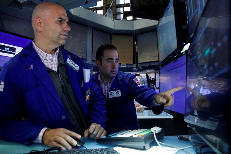 &copy; Reuters. FILE PHOTO: Traders work on the floor of the New York Stock Exchange (NYSE) in New York City, U.S., October 12, 2021.  REUTERS/Brendan McDermid