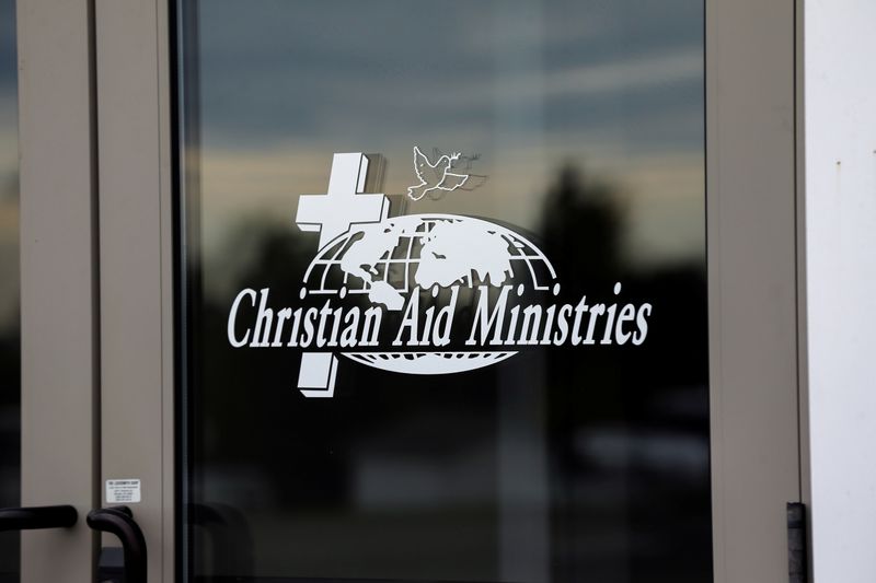 &copy; Reuters. FILE PHOTO: A sign on the door to the entrance of the home office of Christian Aid Ministries in Millersburg, Ohio, U.S., October 17, 2021.  REUTERS/Aaron Josefczyk