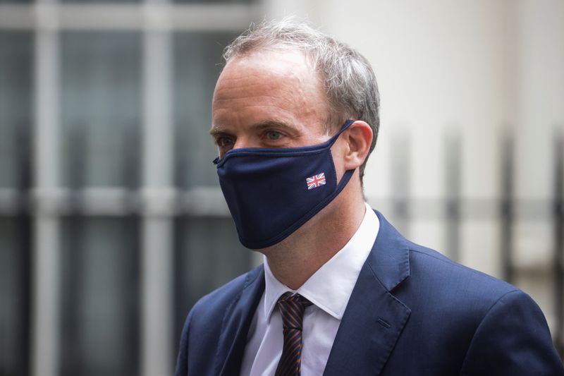 &copy; Reuters. FILE PHOTO: Britain's Foreign Secretary Dominic Raab walks outside Downing Street, in London, Britain, August 16, 2021. REUTERS/Hannah McKay