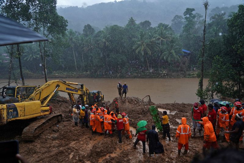 &copy; Reuters. Rescue workers carry the body of a victim after recovering it from the debris of a residential house following a landslide caused by heavy rainfall at Kokkayar village in Idukki district in the southern state of Kerala, India, October 17, 2021.  REUTERS/S