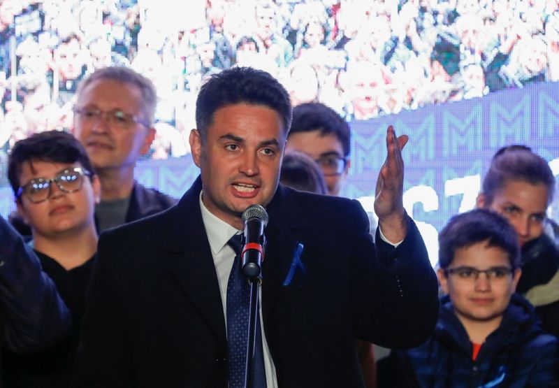 &copy; Reuters. Opposition candidate for prime minister Peter Marki-Zay gestures as he speaks at the election headquarters after the opposition primary election in Budapest, Hungary, October 17, 2021. REUTERS/Bernadett Szabo