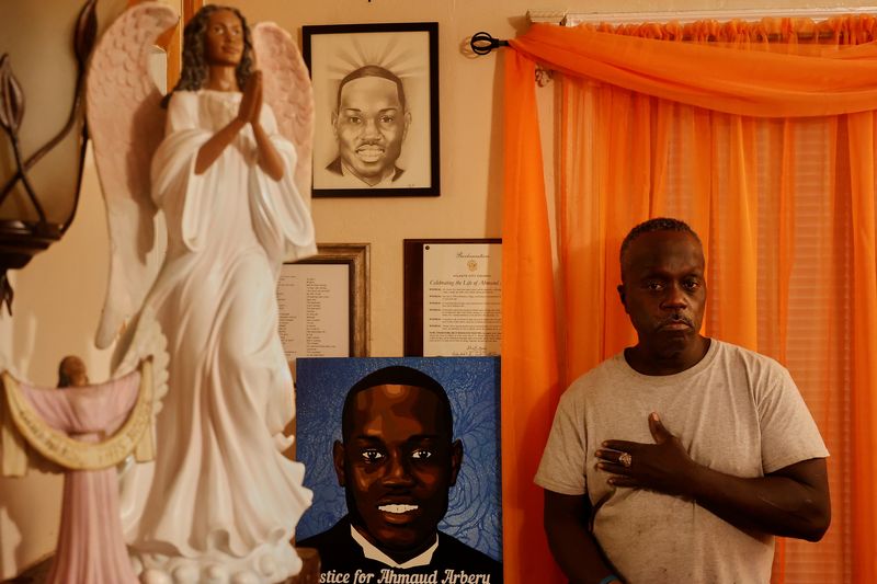 &copy; Reuters. FILE PHOTO: Marcus Arbery poses for a portrait in his living room were portraits of his slain son, Ahmaud Arbery and a Celebration of Life Proclamation that was issued by the Atlanta City Council hangs on the wall in Brunswick, Georgia, U.S. October 11, 2