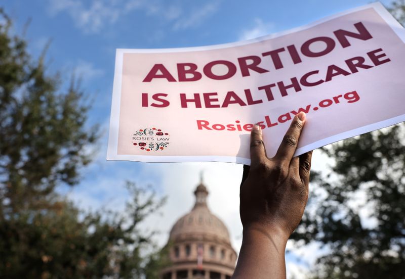 &copy; Reuters. FILE PHOTO: A supporter of reproductive rights holds a sign outside the Texas State Capitol building during the nationwide Women's March, held after Texas rolled out a near-total ban on abortion procedures and access to abortion-inducing medications, in A