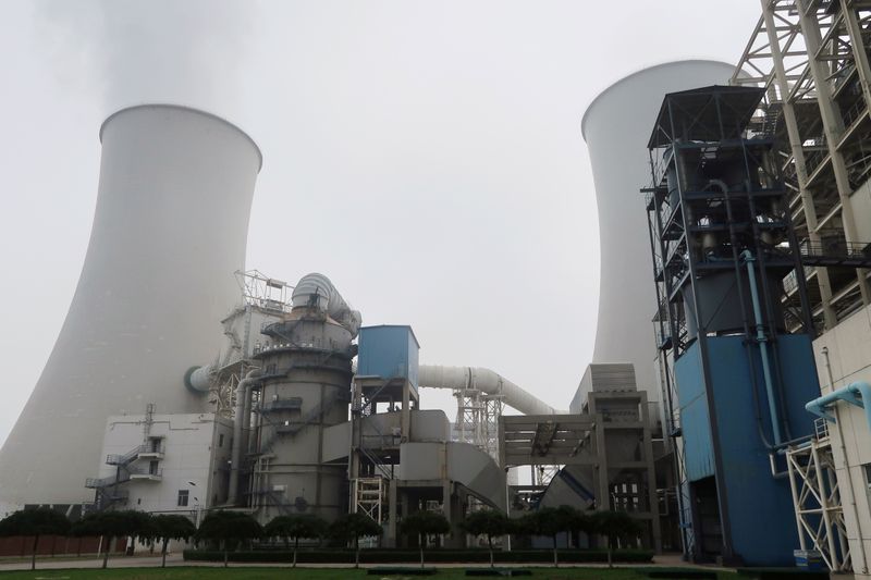 &copy; Reuters. FILE PHOTO: Water vapour rises from a cooling tower of a China Energy ultra-low emission coal-fired power plant during a media tour, in Sanhe, Hebei province, China July 18, 2019. REUTERS/Shivani Singh