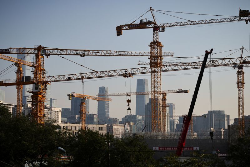 &copy; Reuters. FILE PHOTO: A view shows cranes in front of the skyline of the Central Business District (CBD) in Beijing, China, October 18, 2021.   REUTERS/Thomas Peter