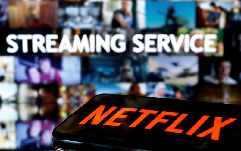 &copy; Reuters. FILE PHOTO: A smartphone with the Netflix logo lies in front of displayed "Streaming service" words in this illustration taken March 24, 2020. REUTERS/Dado Ruvic/Illustration/File Photo