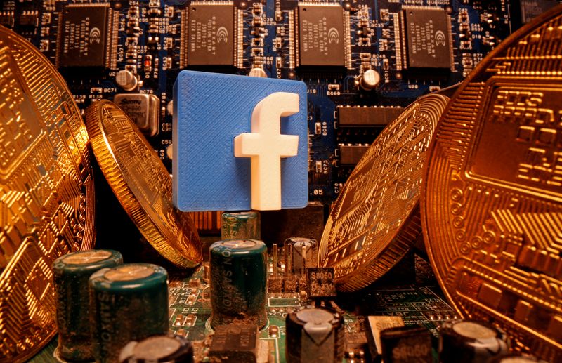 &copy; Reuters. A 3D-printed Facebook logo and representations of cryptocurrency are standing on a motherboard in this picture illustration taken April 17, 2020. REUTERS/Dado Ruvic/Illustration