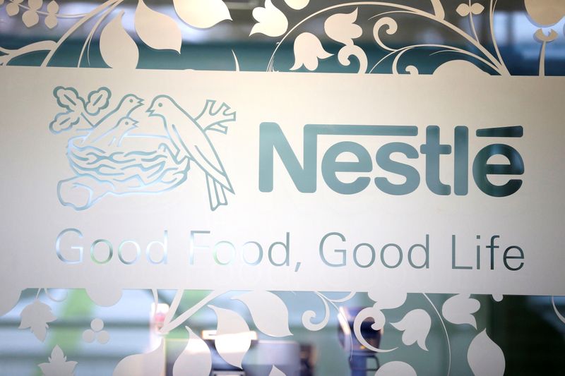 &copy; Reuters. FILE PHOTO: Nestle logo is pictured on the door of the supermarket of Nestle headquarters in Vevey, Switzerland, February 13, 2020. REUTERS/Pierre Albouy