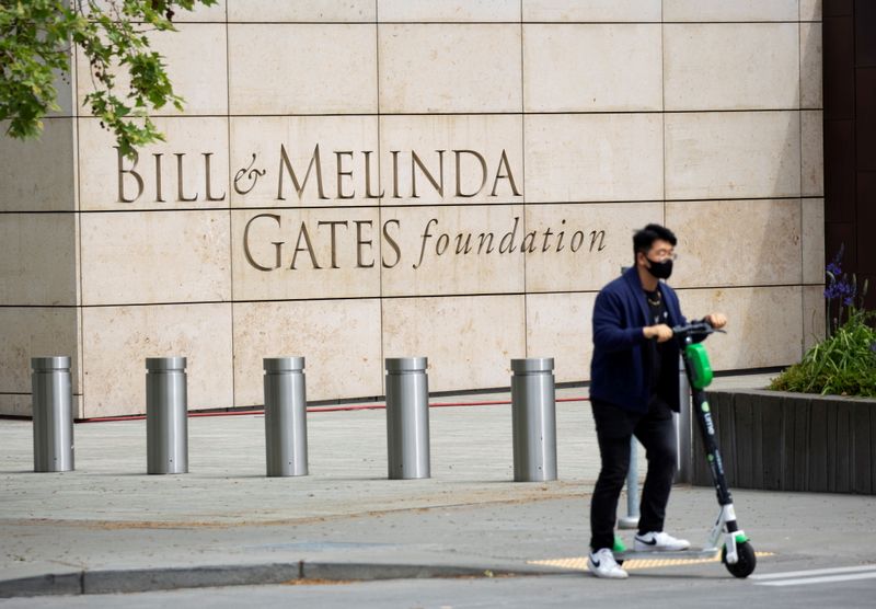 &copy; Reuters. FILE PHOTO: A person passes by on a scooter in front of the Bill & Melinda Gates Foundation in Seattle, Washington, U.S. May 5, 2021.  REUTERS/Lindsey Wasson