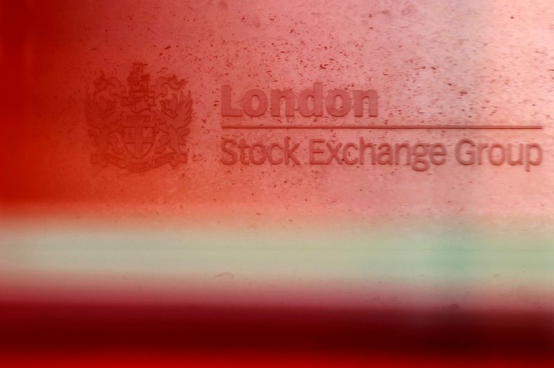 &copy; Reuters. FILE PHOTO: A red London bus passes the Stock Exchange in London, Britain, February 9, 2011.   REUTERS/Luke MacGregor/File Photo