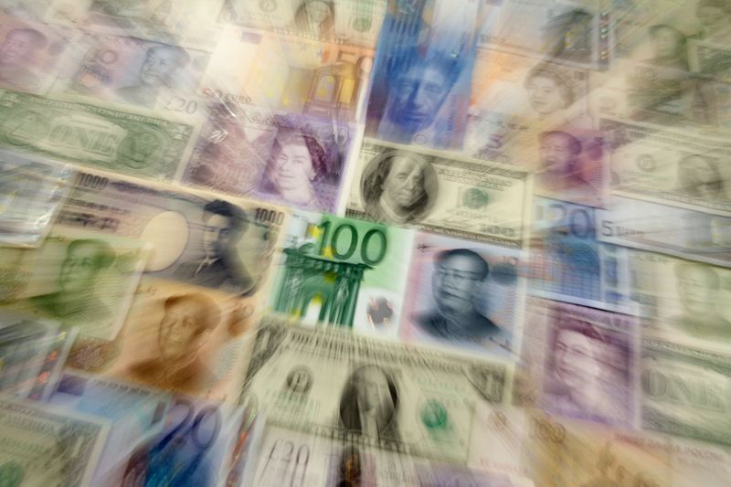 &copy; Reuters. Arrangement of various world currencies including Chinese Yuan, Japanese Yen, US Dollar, Euro, British Pound, Swiss Franc and Russian Rouble pictured in Warsaw January 26, 2011. REUTERS/Kacper Pempel  (POLAND - Tags: BUSINESS)