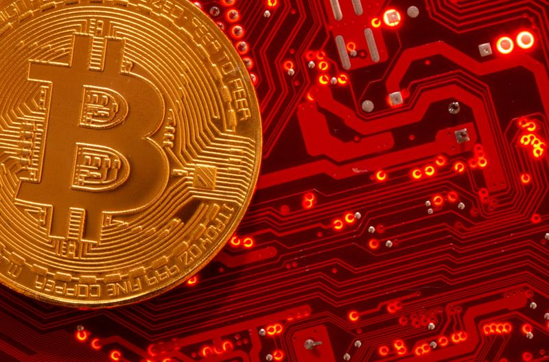 &copy; Reuters. Representation of cryptocurrency Bitcoin is placed on PC motherboard in this illustration taken, June 29, 2021. REUTERS/Dado Ruvic/Illustration