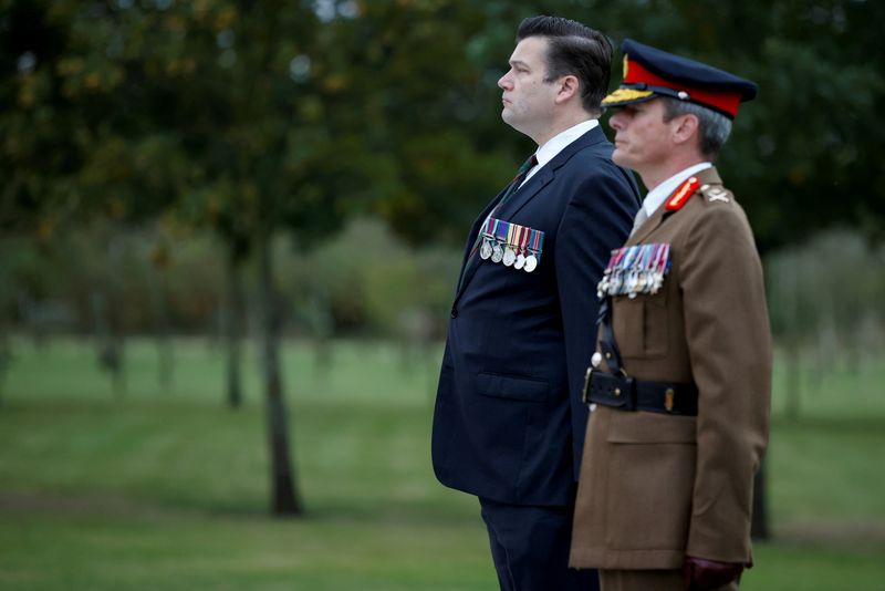 &copy; Reuters. FILE PHOTO: Britain's Minister of the Armed Forces James Heappey and Major General Gerald Stricklands attend a memorial service at the Camp Bastion Memorial at the National Memorial Arboretum in Staffordshire, Britain, October 7, 2021. REUTERS/Phil Noble