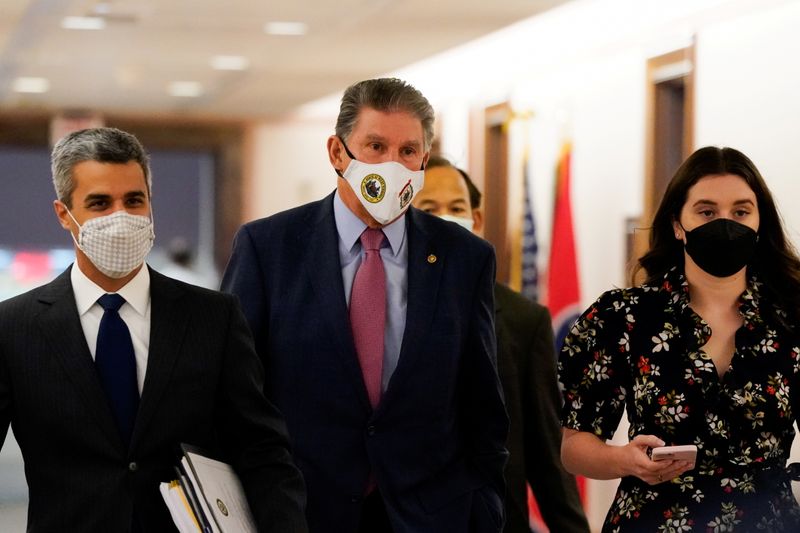 &copy; Reuters. Senate Energy and Natural Resources Committee Chair Joe Manchin (D-WV) walks through Dirksen Senate Office Building on his way to a hearing on Capitol Hill in Washington, U.S., October 21, 2021. REUTERS/Elizabeth Frantz