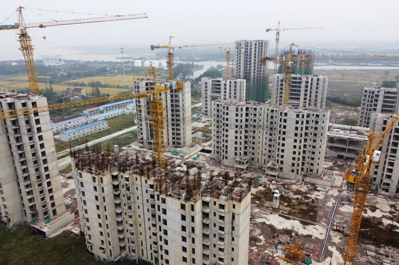 &copy; Reuters. An aerial view shows residential buildings at the construction site of Evergrande Cultural Tourism City, a China Evergrande Group project whose construction has halted, in Suzhou's Taicang, Jiangsu province, China October 22, 2021. Picture taken with a dr