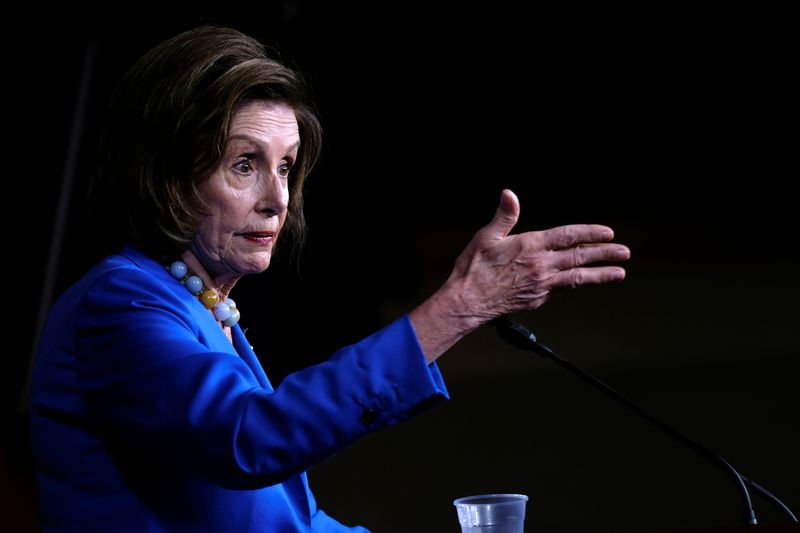 © Reuters. FILE PHOTO: U.S. House Speaker Nancy Pelosi (D-CA) holds her weekly news conference at the U.S. Capitol in Washington, U.S., October 12, 2021. REUTERS/James Lawler Duggan