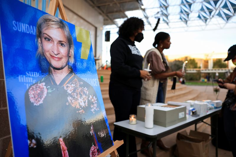 &copy; Reuters. FILE PHOTO: An image of cinematographer Halyna Hutchins, who died after being shot by Alec Baldwin on the set of his movie "Rust", is displayed at a vigil in her honour in Albuquerque, New Mexico, U.S., October 23, 2021.  REUTERS/Kevin Mohatt